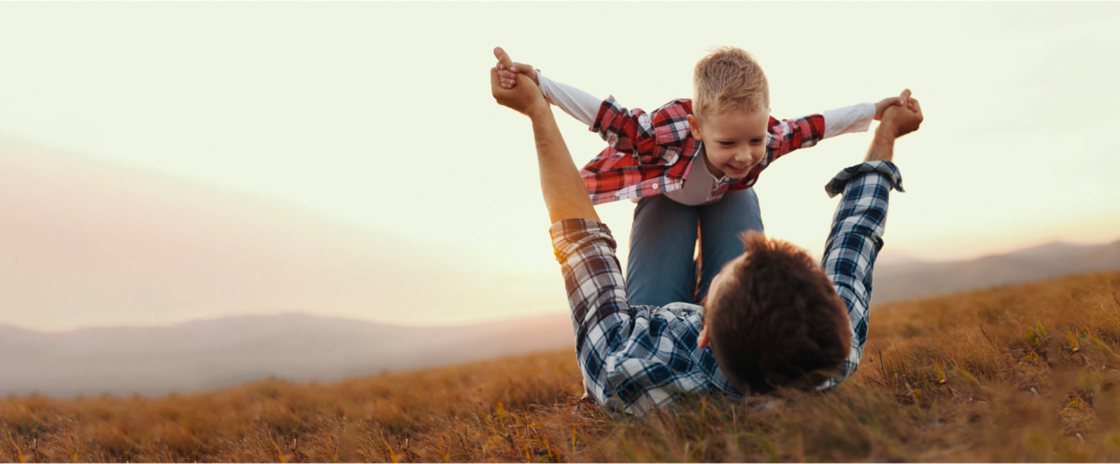 Dad lifting child photo