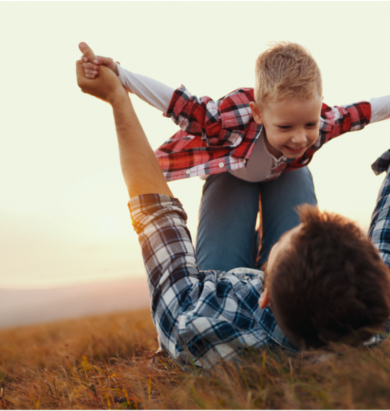 Dad lifting child photo